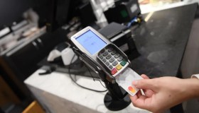 Taglio del personale Nexi in Italia, 10% a casa e trattative con i sindacati