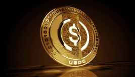 Moneta digitale dorata con simbolo del dollaro e sigla USDC, immagine simbolica delle stablecoin e dei pagamenti digitali.